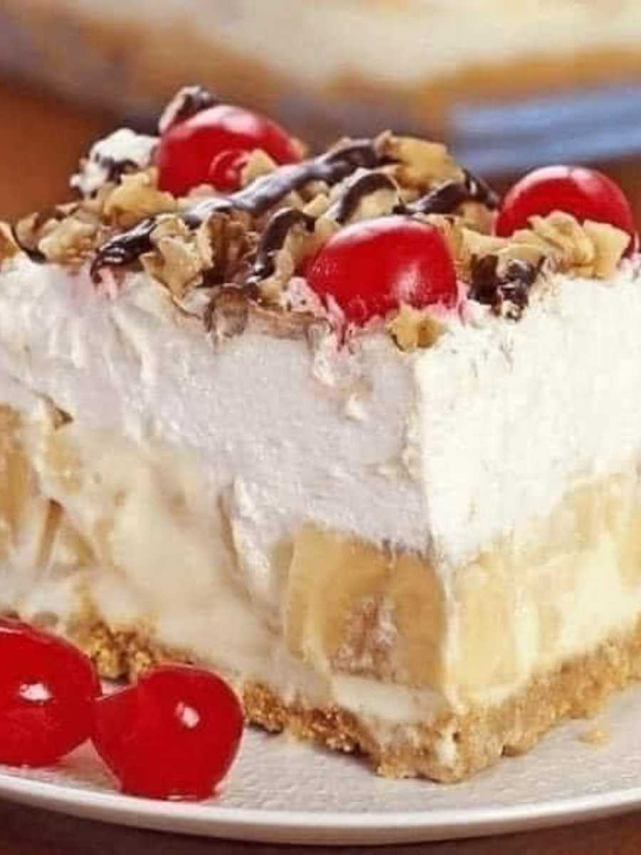 No-Bake Banana Split Dessert - Indulge in the delightful layers of graham cracker crust, creamy filling, fresh fruits, and nuts. A quick and easy no-bake treat for your sweet cravings!
